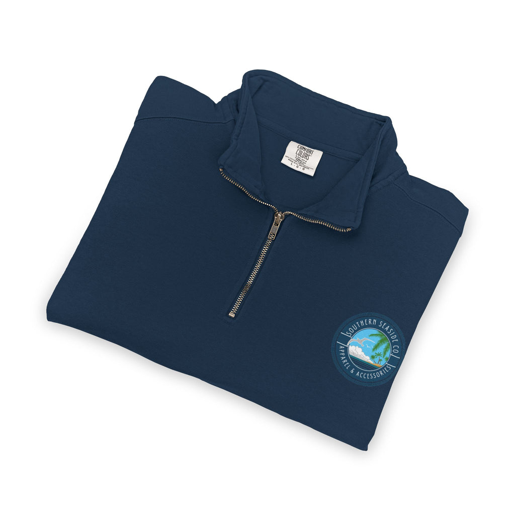 Folded navy blue Comfort Colors Quarter Zip Sweatshirt with a Southern Seaside Company logo on a white background