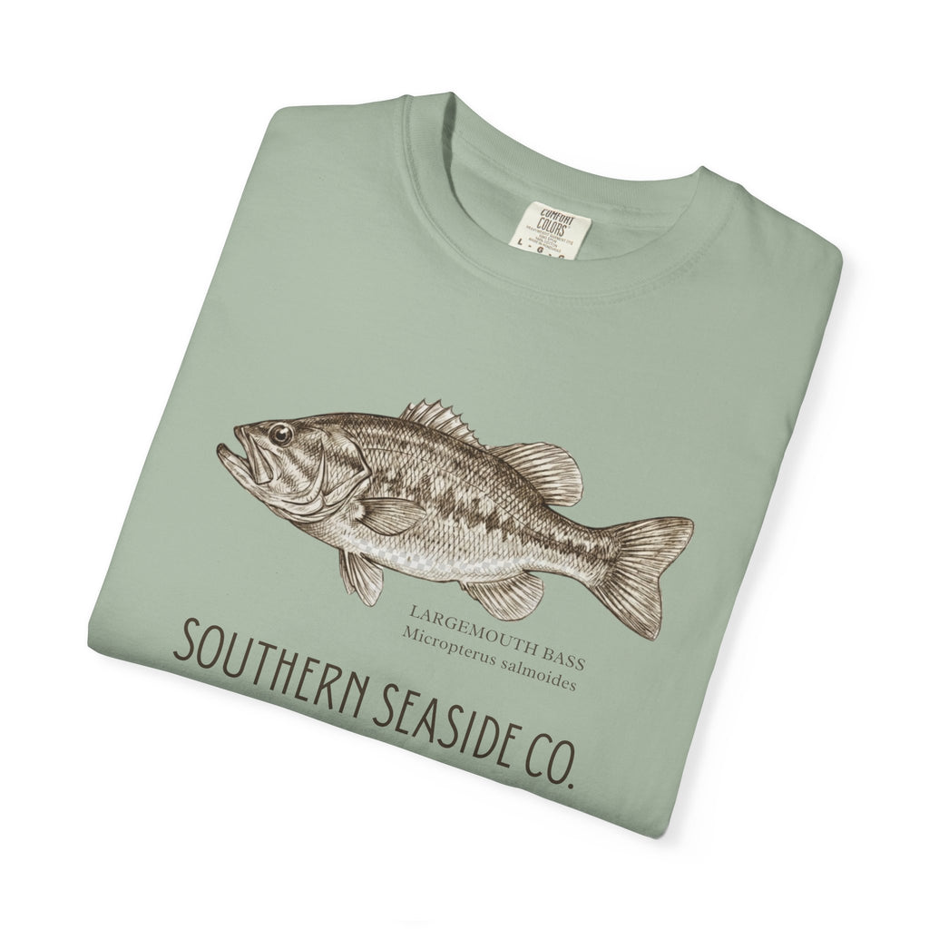 Folded green t-shirt with a largemouth bass fish illustration.