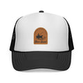 Casting Worries Away River Bound White and black trucker hat with a brown leather patch on a white background