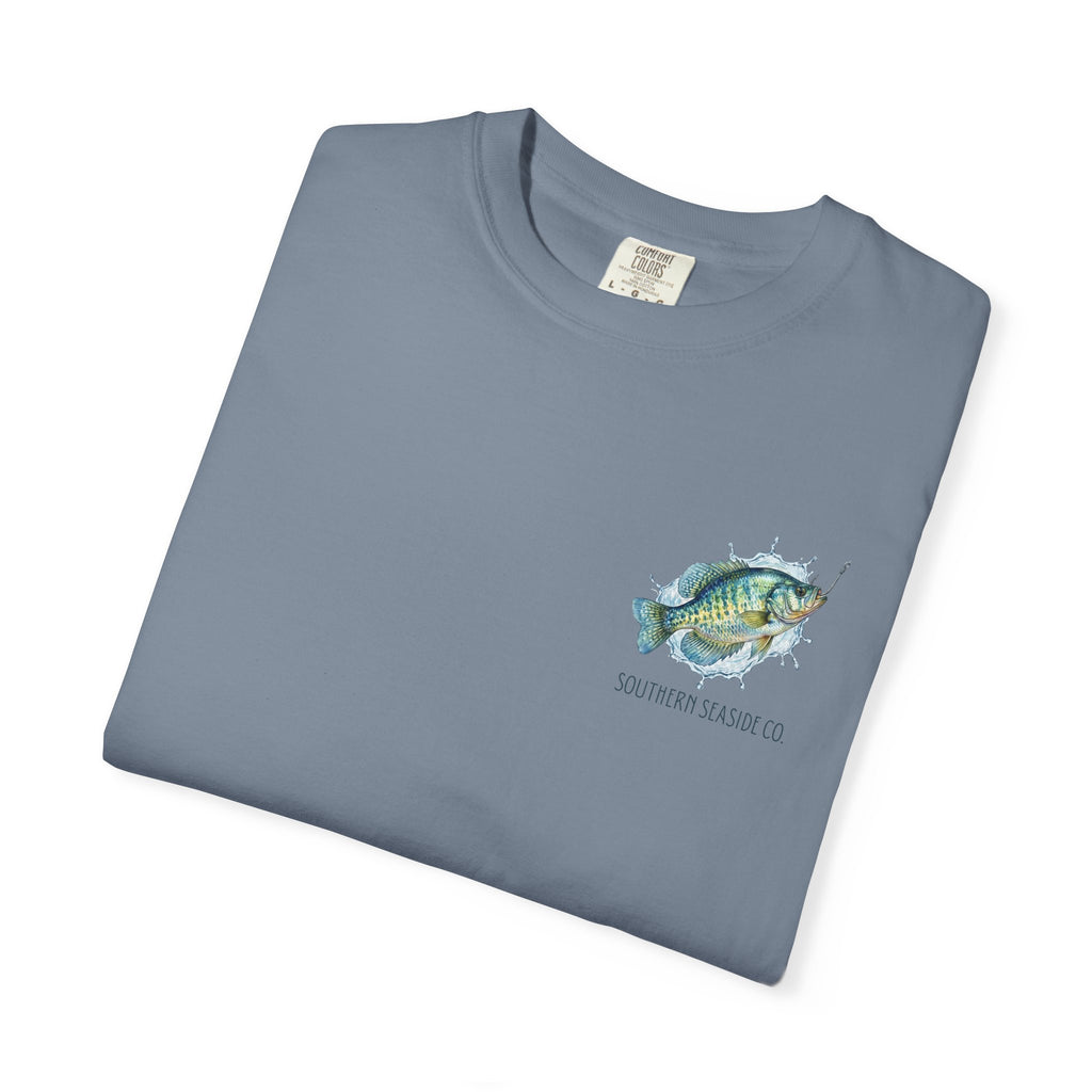 Folded blue t-shirt with crappie fish graphic and 'Southern Season Co' text on a white background