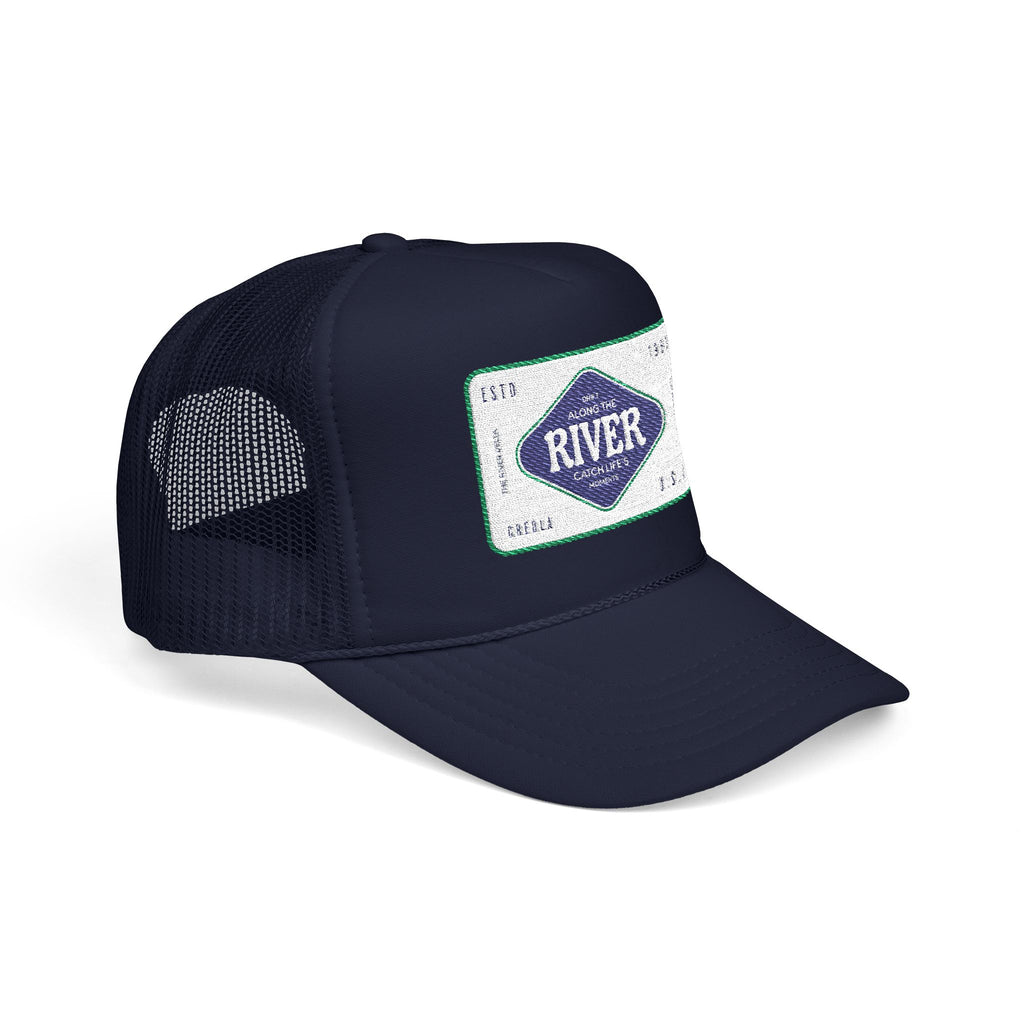 Navy blue trucker cap with a branded River fishing patch on a white background