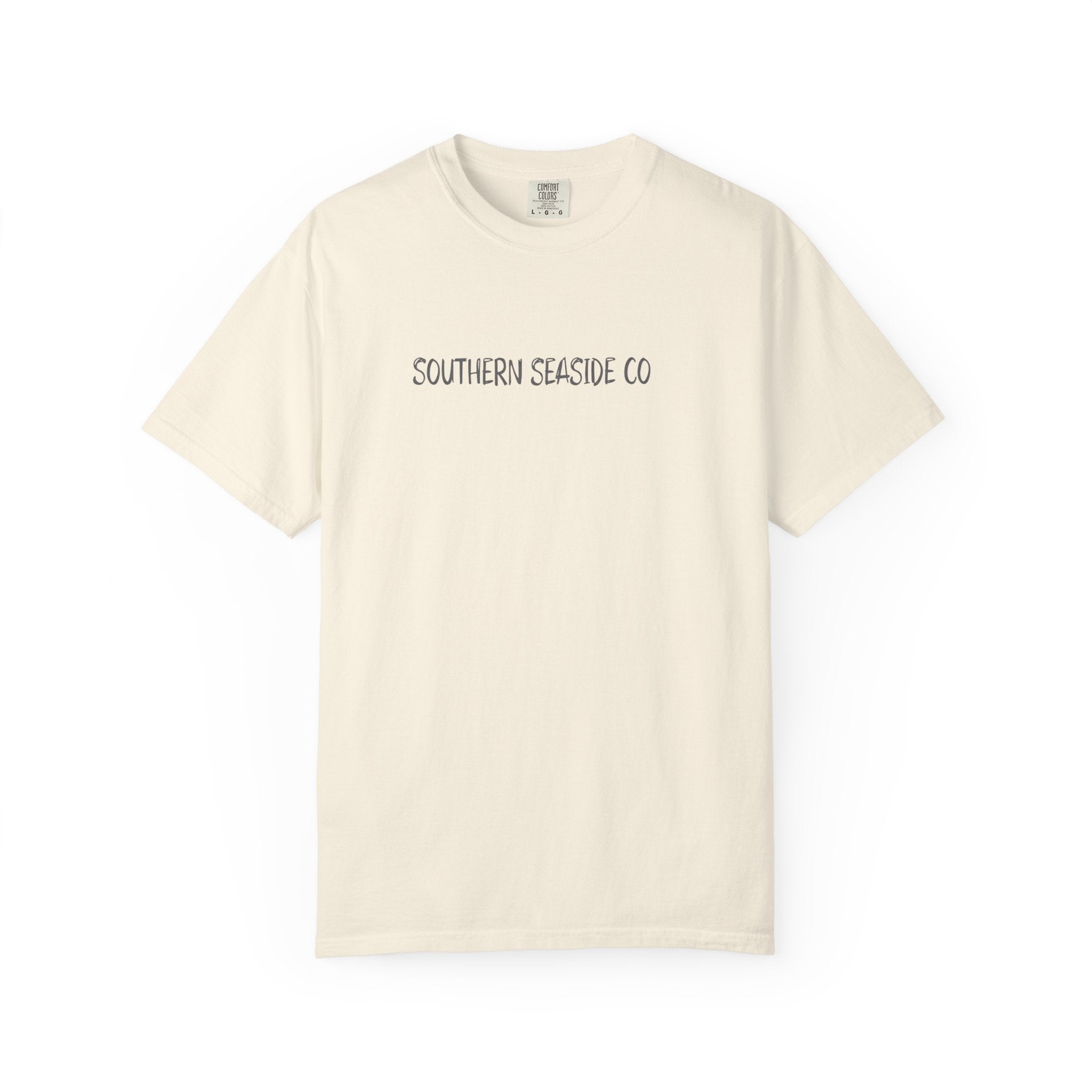 A ivory comfort colors tee with Southern  Seaside Co logo on the front chest area.