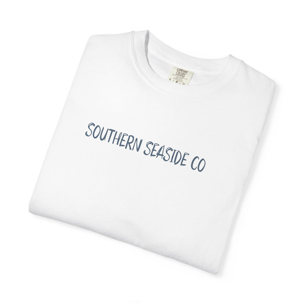 Folded white t-shirt with 'SOUTHERN SEASIDE CO' text on a white background
