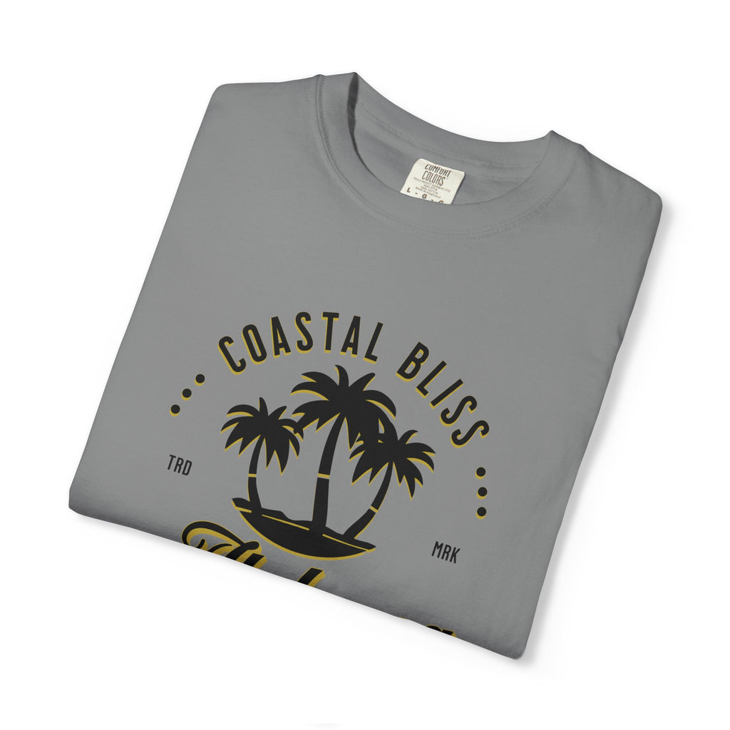 Folded gray t-shirt with 'Coastal Bliss' text and palm tree design on a white background
