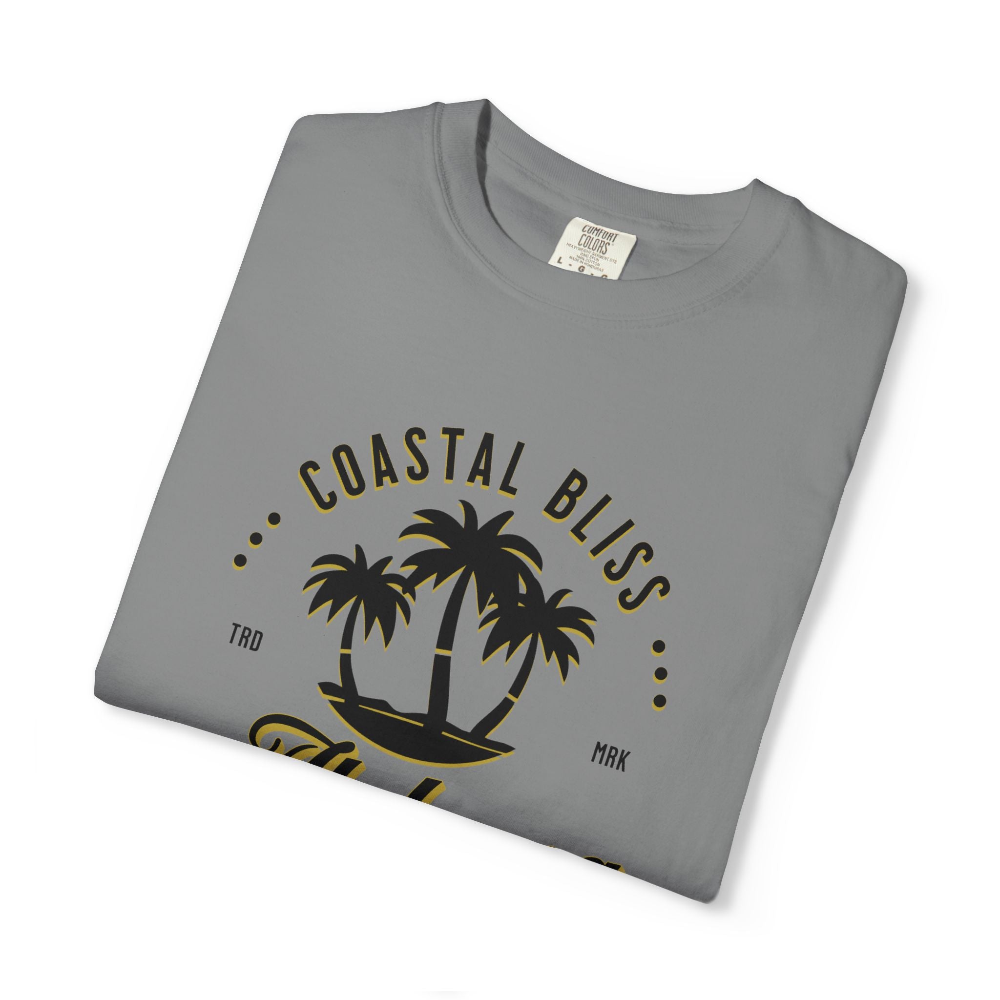 Folded gray t-shirt with 'Coastal Bliss' text and palm tree design on a white background