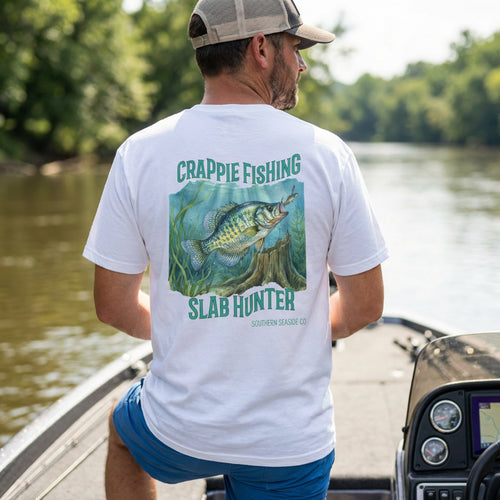 Man on a boat wearing a crappie fishing design white t-shirt 