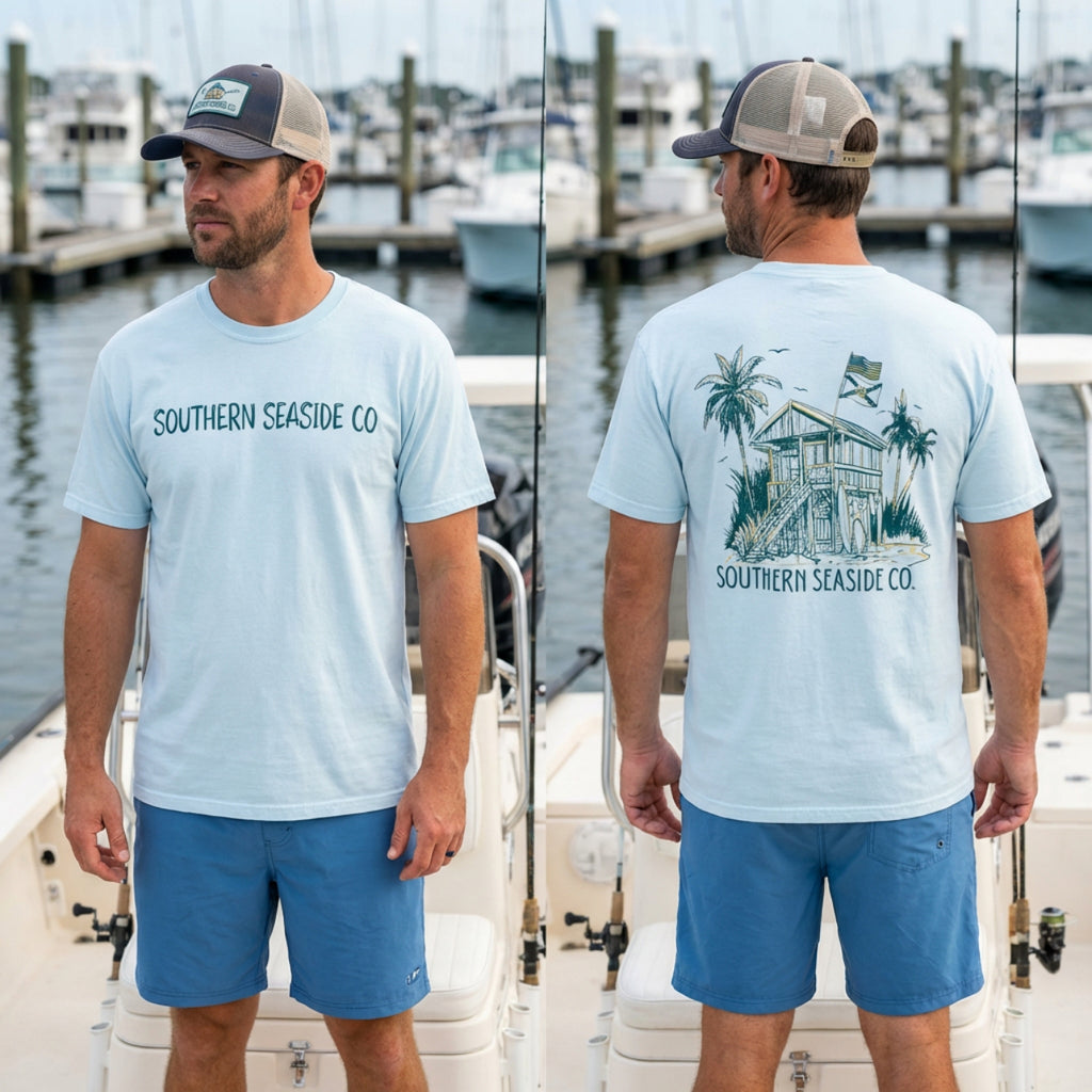 Man wearing a light blue t-shirt with 'Southern Seaside Co' branding on a boat.