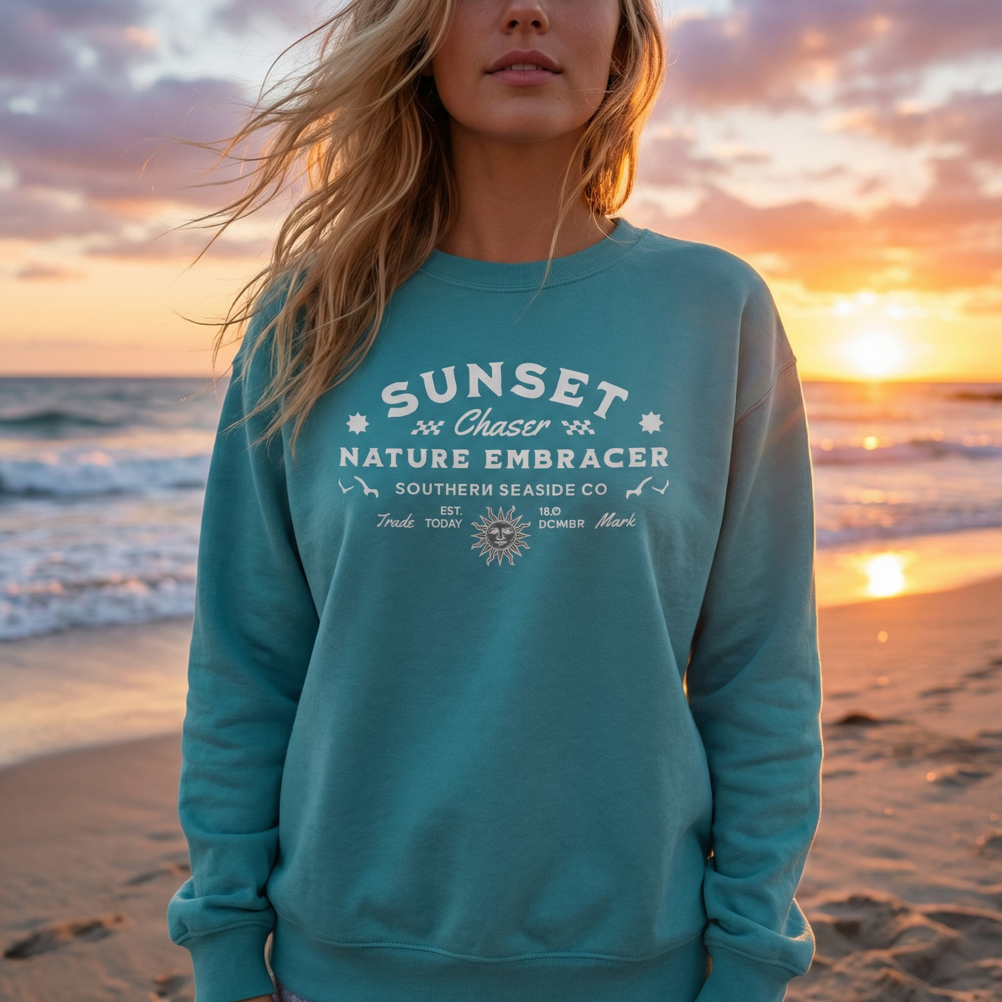 Comfort Colors sweatshirt with ‘Sunset Chaser Nature Embracer’ design, worn on a beach at sunset with warm golden light.