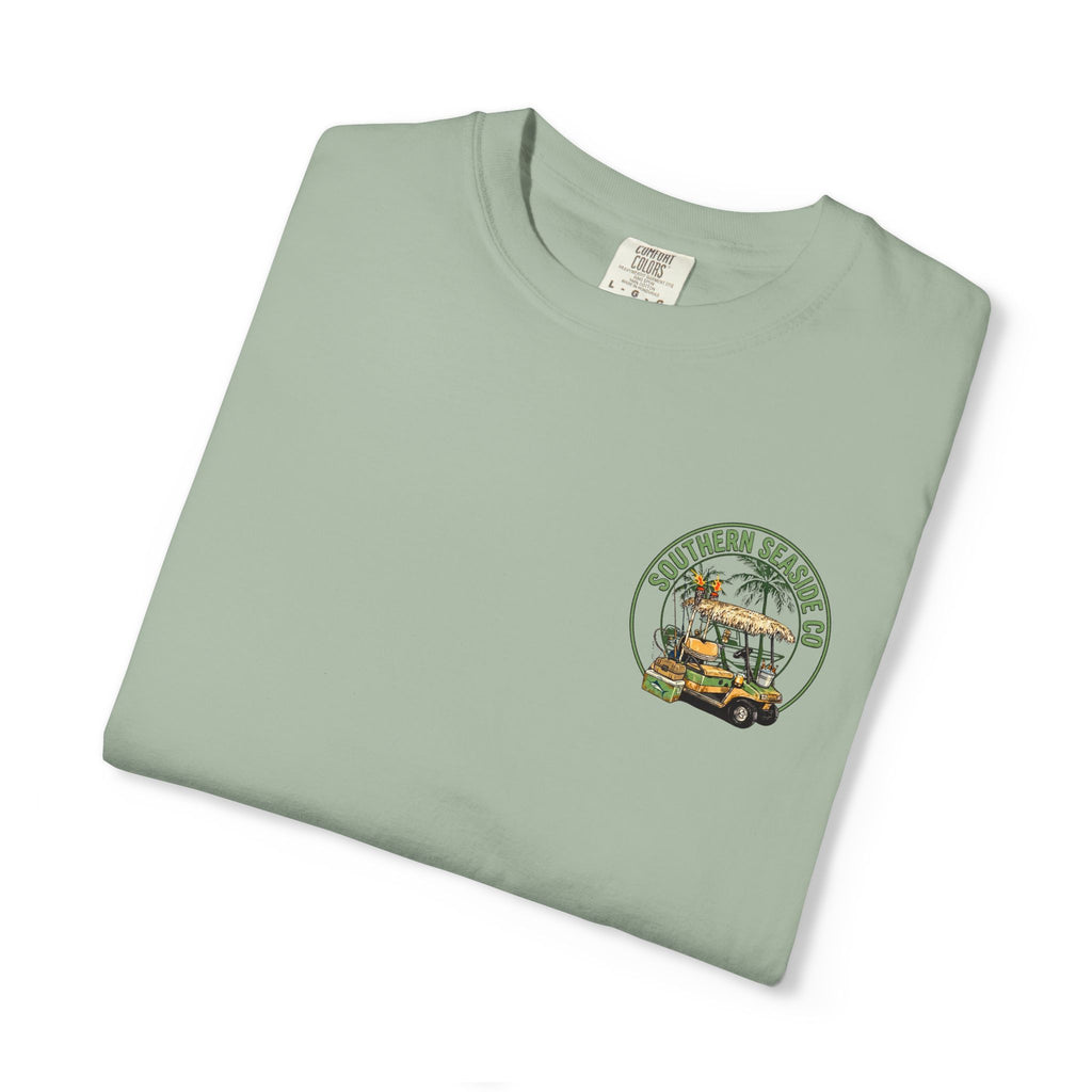 Folded light green t-shirt with a golf cart graphic design on a white background
