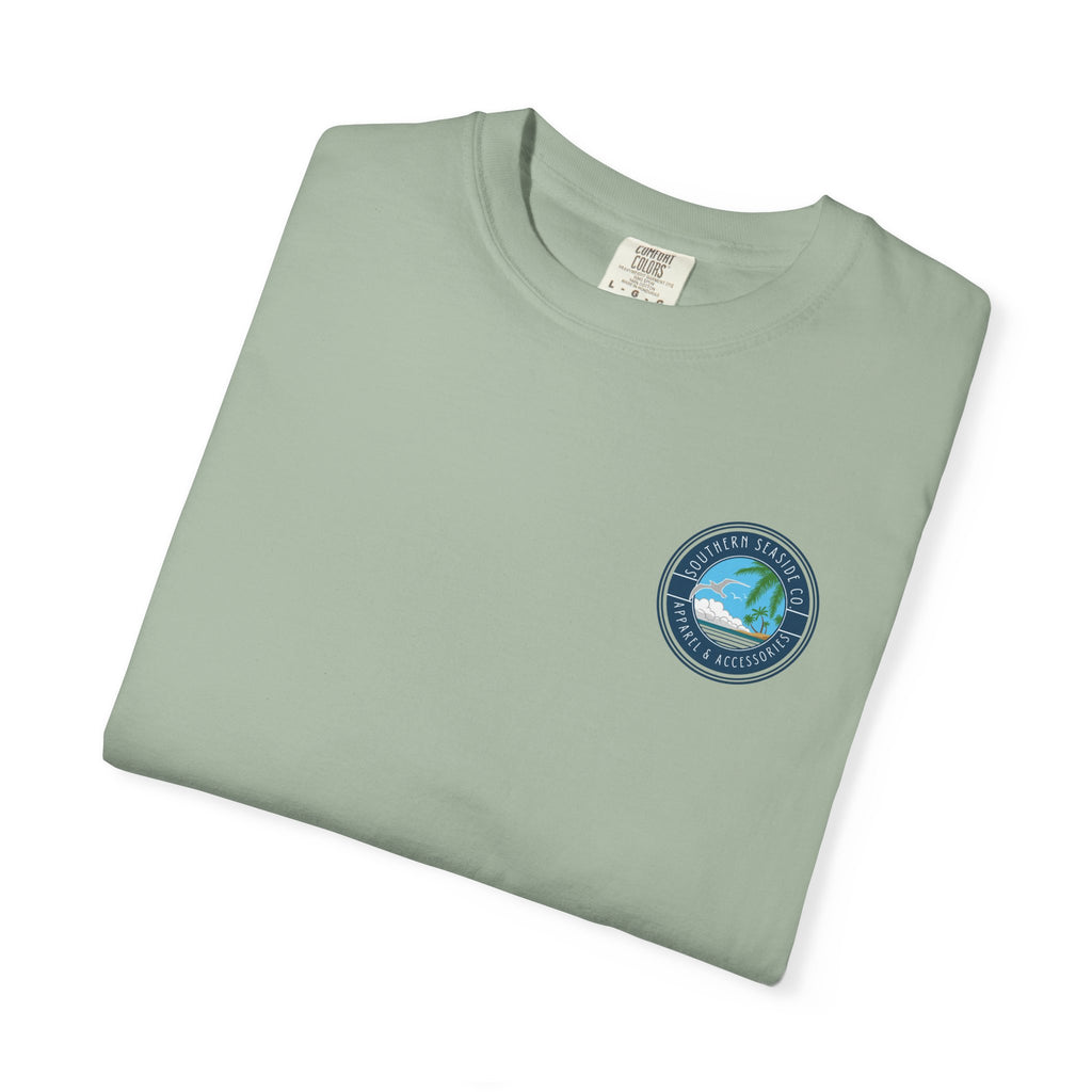 Folded light green t-shirt with a Southern Seaside Company logo on a white background