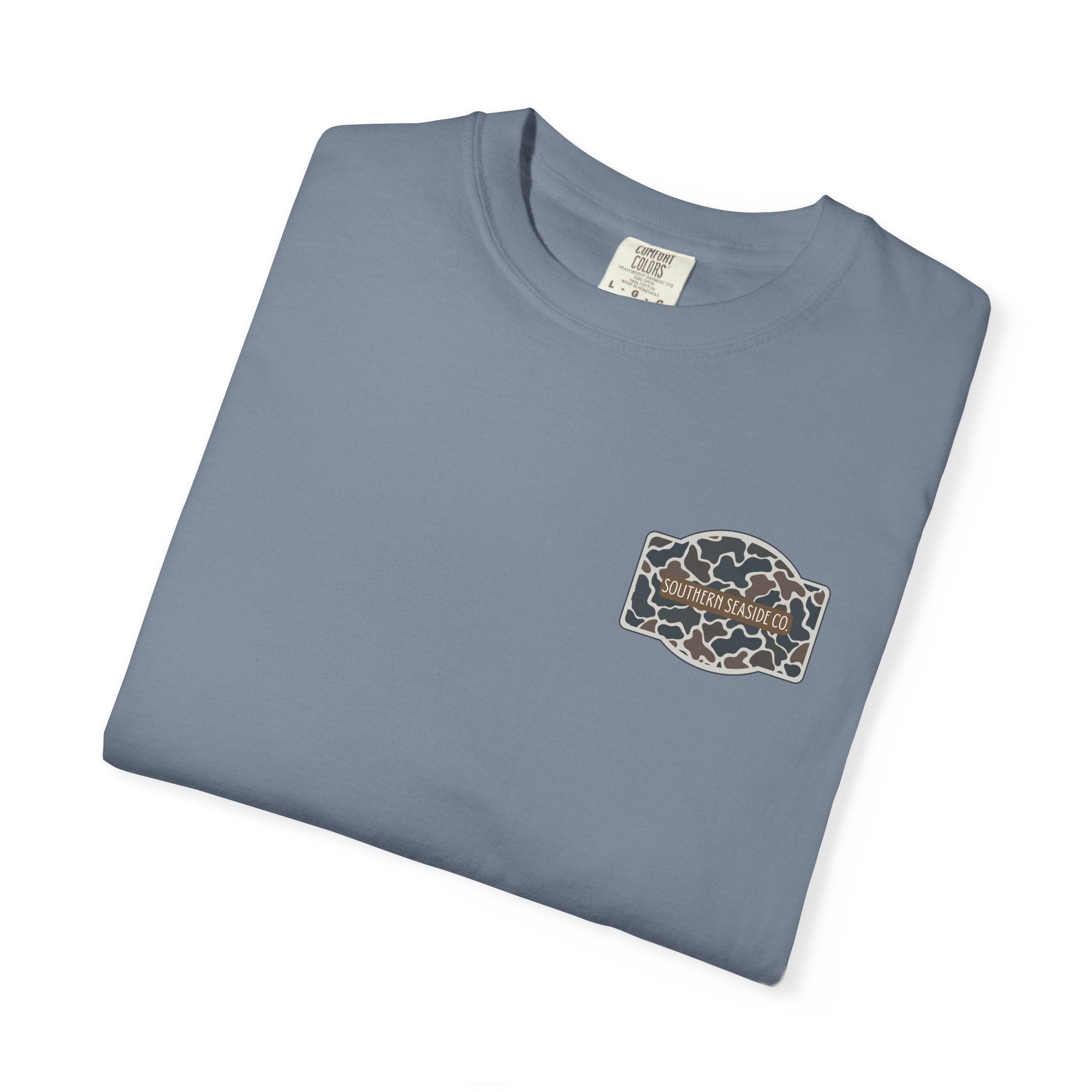 Folded blue t-shirt with a Southern Seaside Co logo on a white background