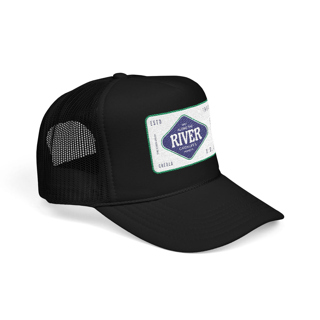 Black trucker cap with a branded patch of the River Delta in Creola Alabama on a white background