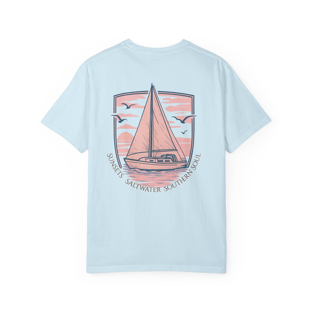 Light blue t-shirt with a sailboat graphic and text of Sunsets, saltwater, Southern Soul 