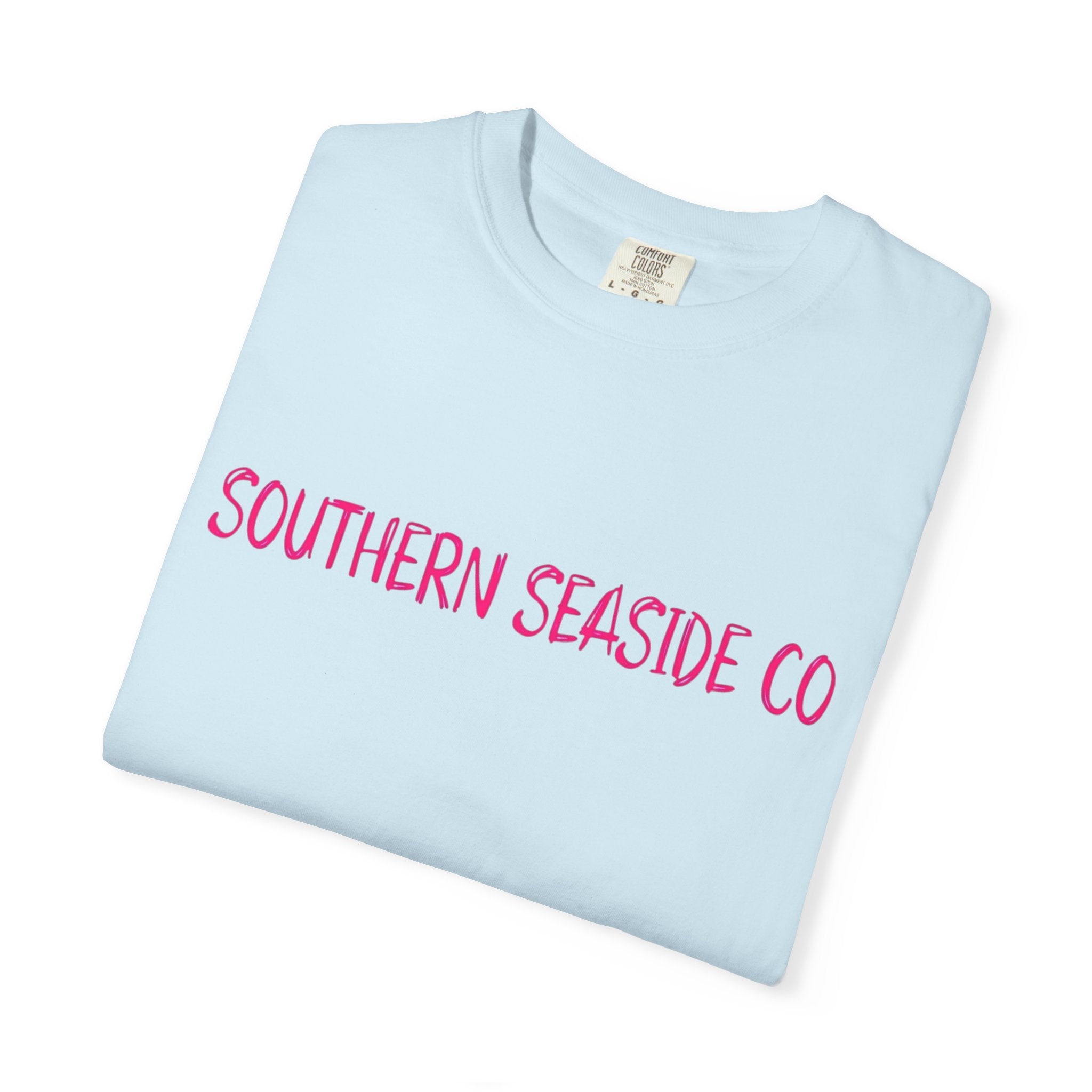 Light blue t-shirt with pink text 'SOUTHERN SEASIDE CO' on a white background