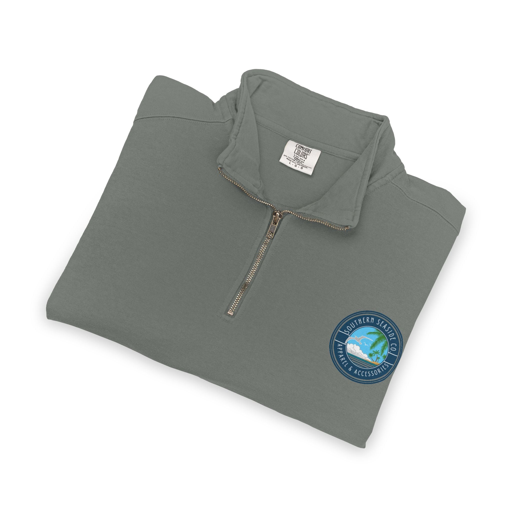 Folded gray Comfort Colors Quarter Zip Sweatshirt pullover with a Southern Seaside logo on a white background