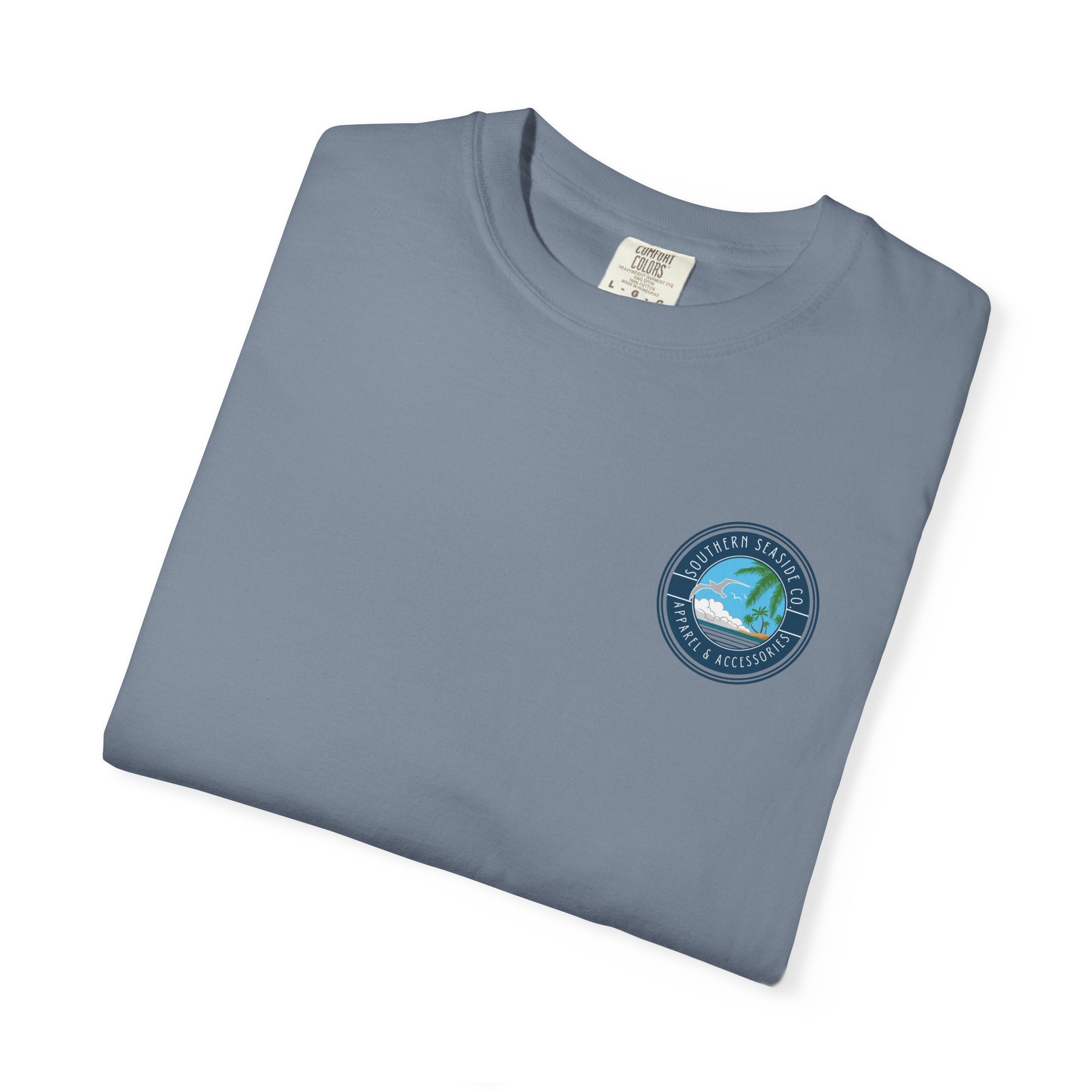 Folded blue t-shirt with a Southern Seaside Co logo on a white background