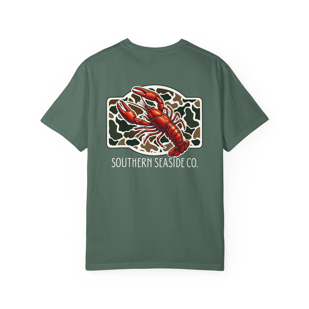 Crawfish T-Shirt. A Green comfort colors t-shirt with a crawfish graphic and 'Southern Seaside Co.' text on a camo print background