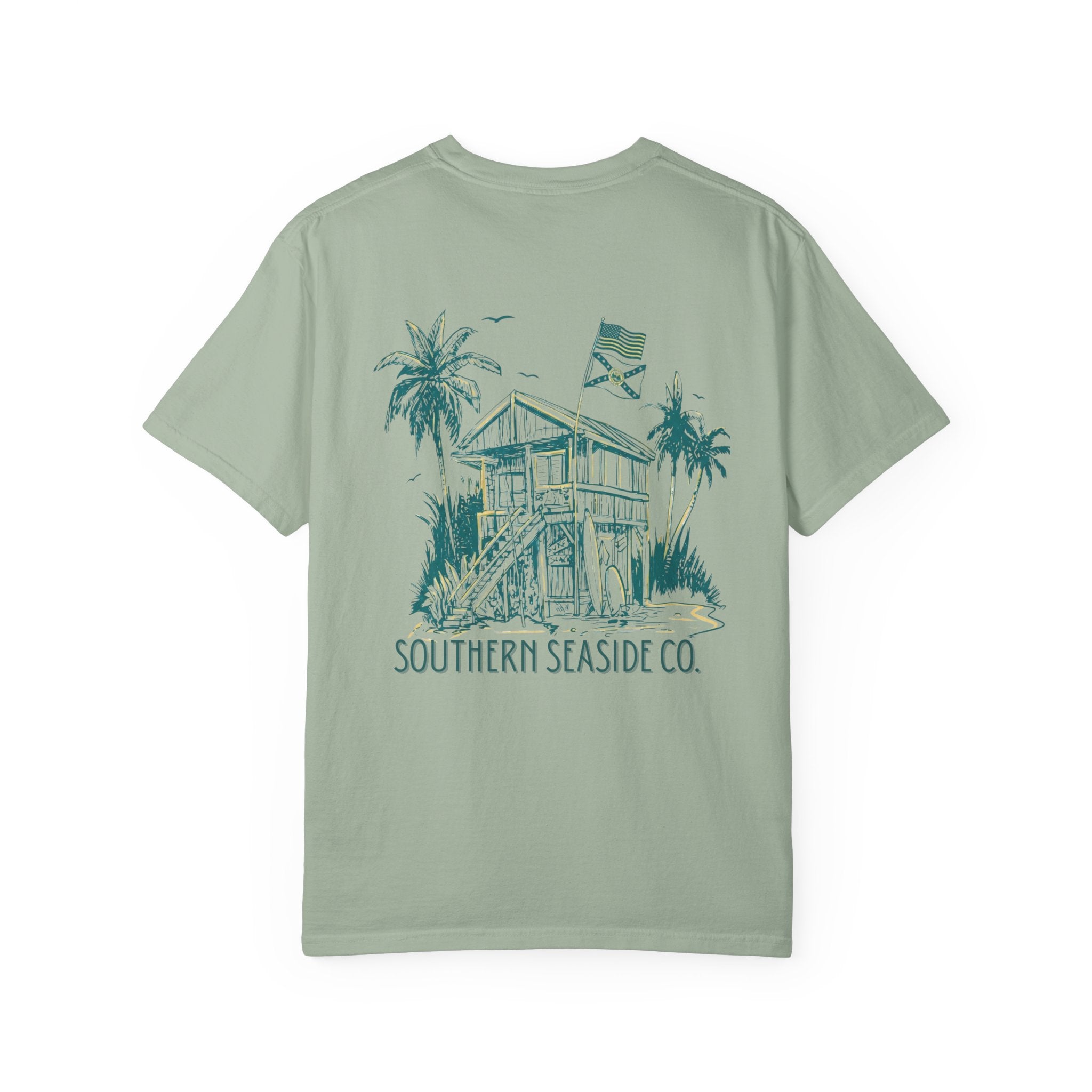 Light green t-shirt with a beach house graphic and 'Southern Seaside Co.' text on a white background
