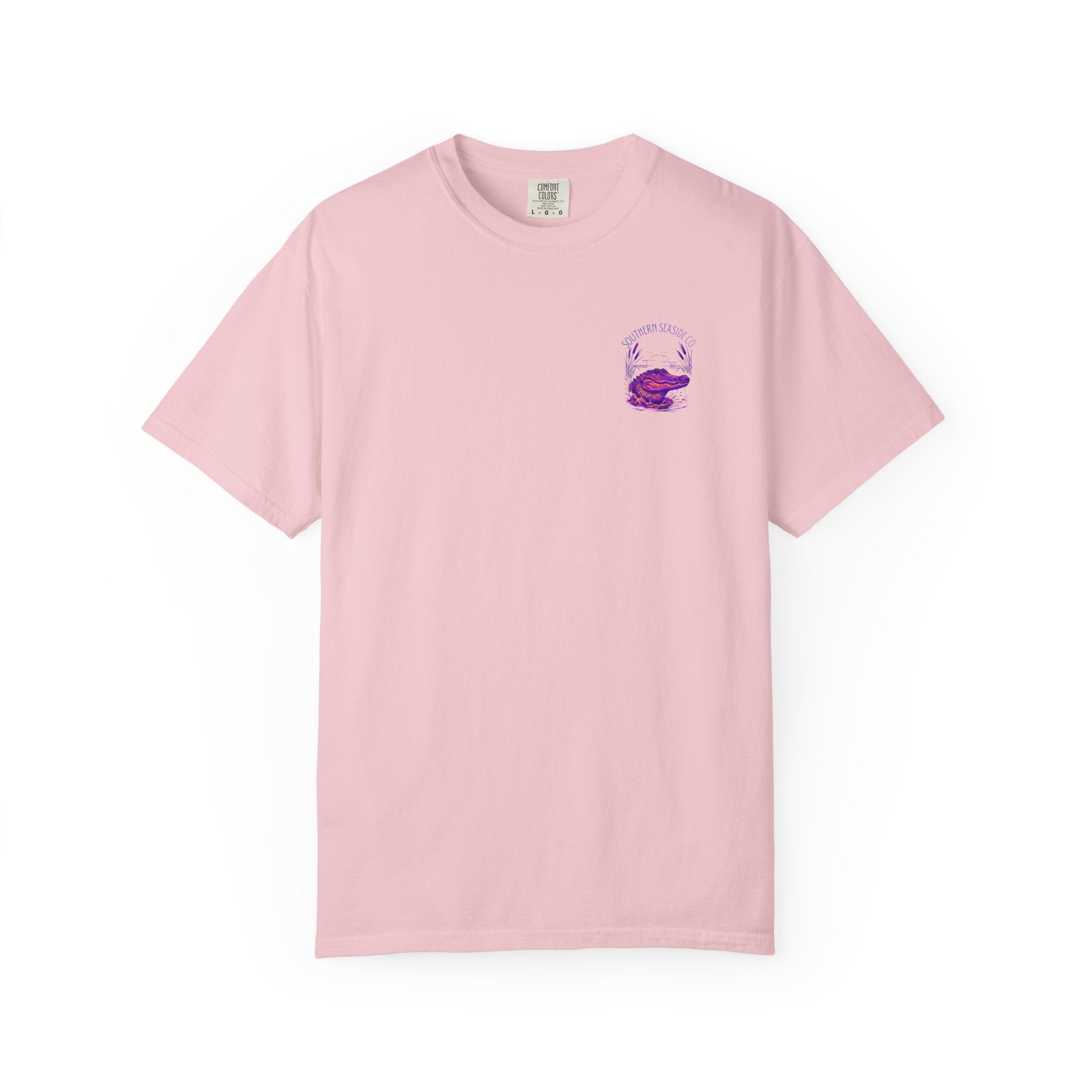 Pink t-shirt with a small alligator logo on the chest against a white background
