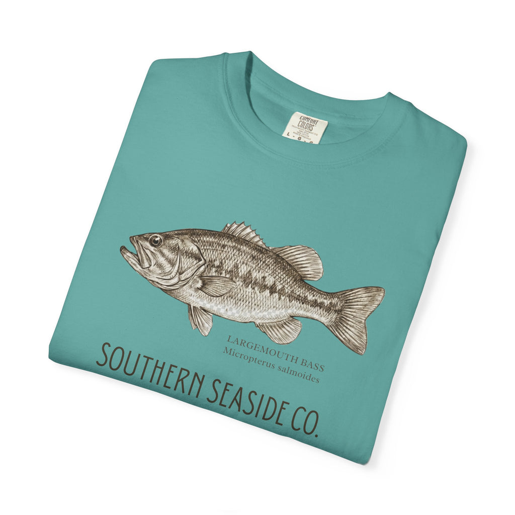 Folded teal t-shirt with a largemouth bass illustration and 'Southern Seaside Co.' text on a white background