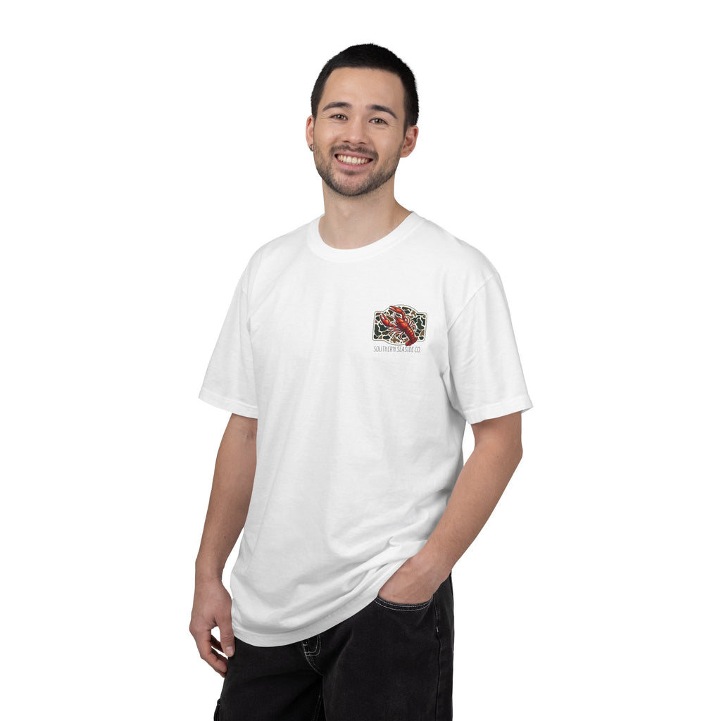 Man wearing a white t-shirt with a small crawfish image and Southern Seaside logo on a white background