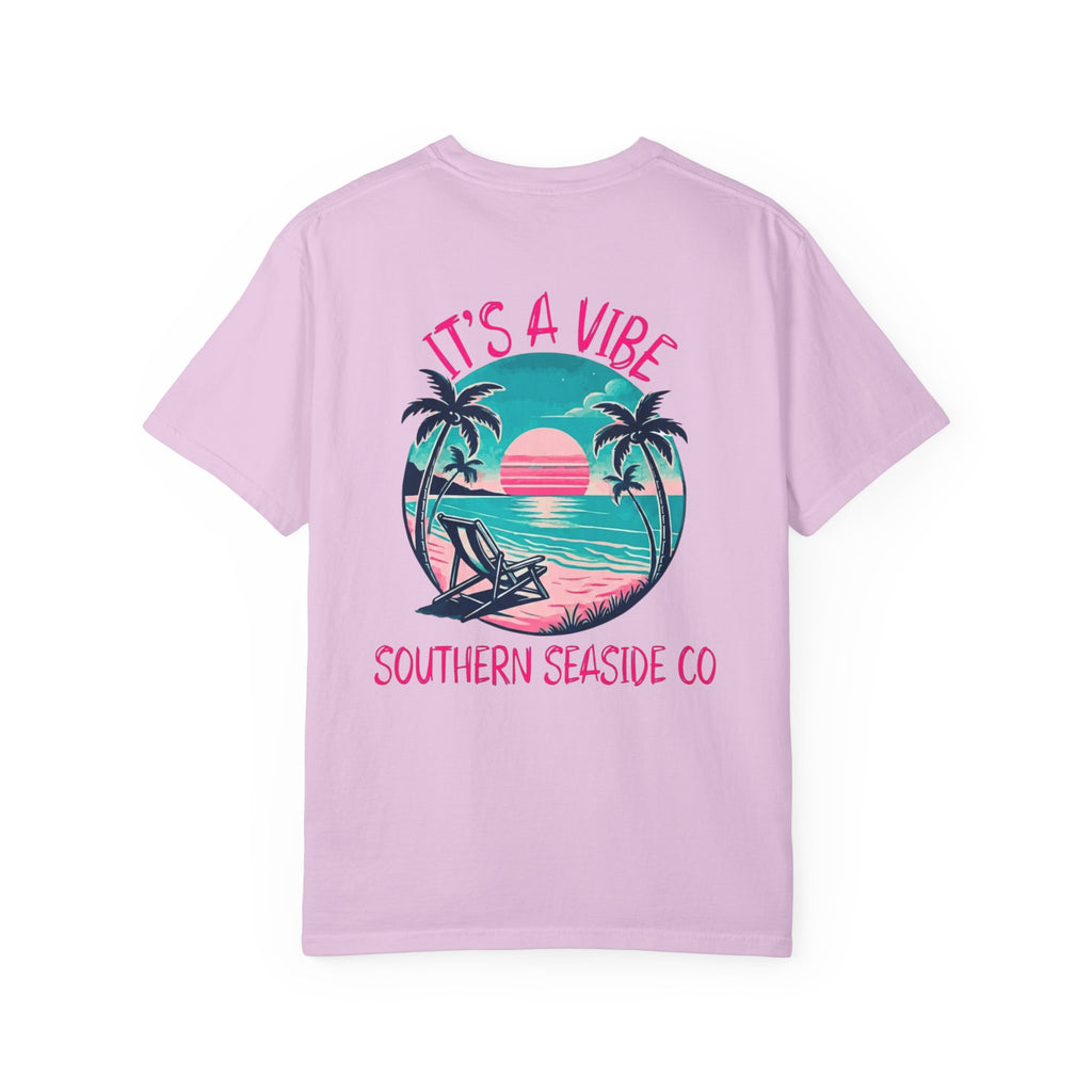 Pink t-shirt with a tropical graphic and 'It's a Vibe' text on a white background