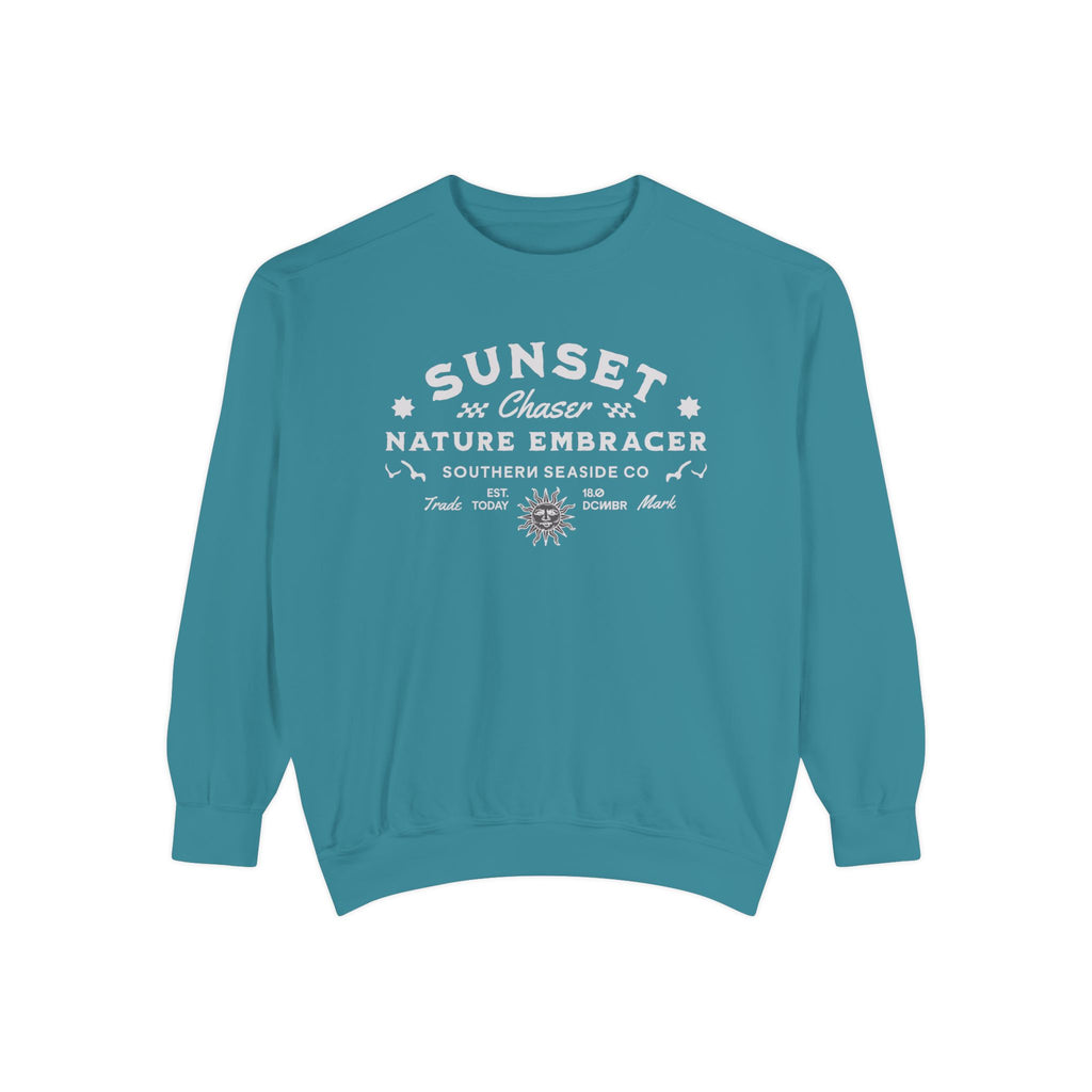 Teal sweatshirt with white text and graphics on a white background
