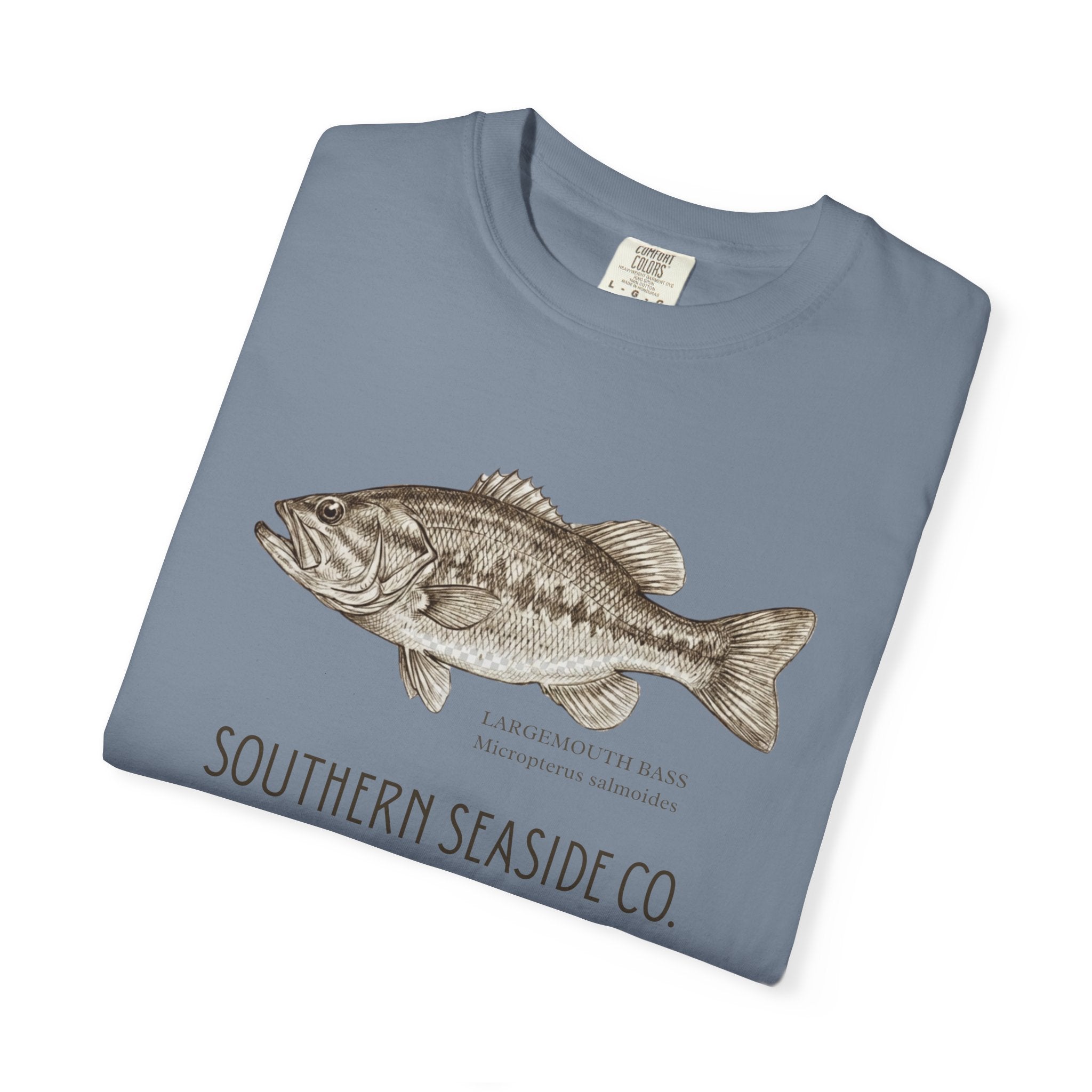 Folded blue t-shirt with a largemouth bass illustration and 'Southern Seaside Co.' text on a white background